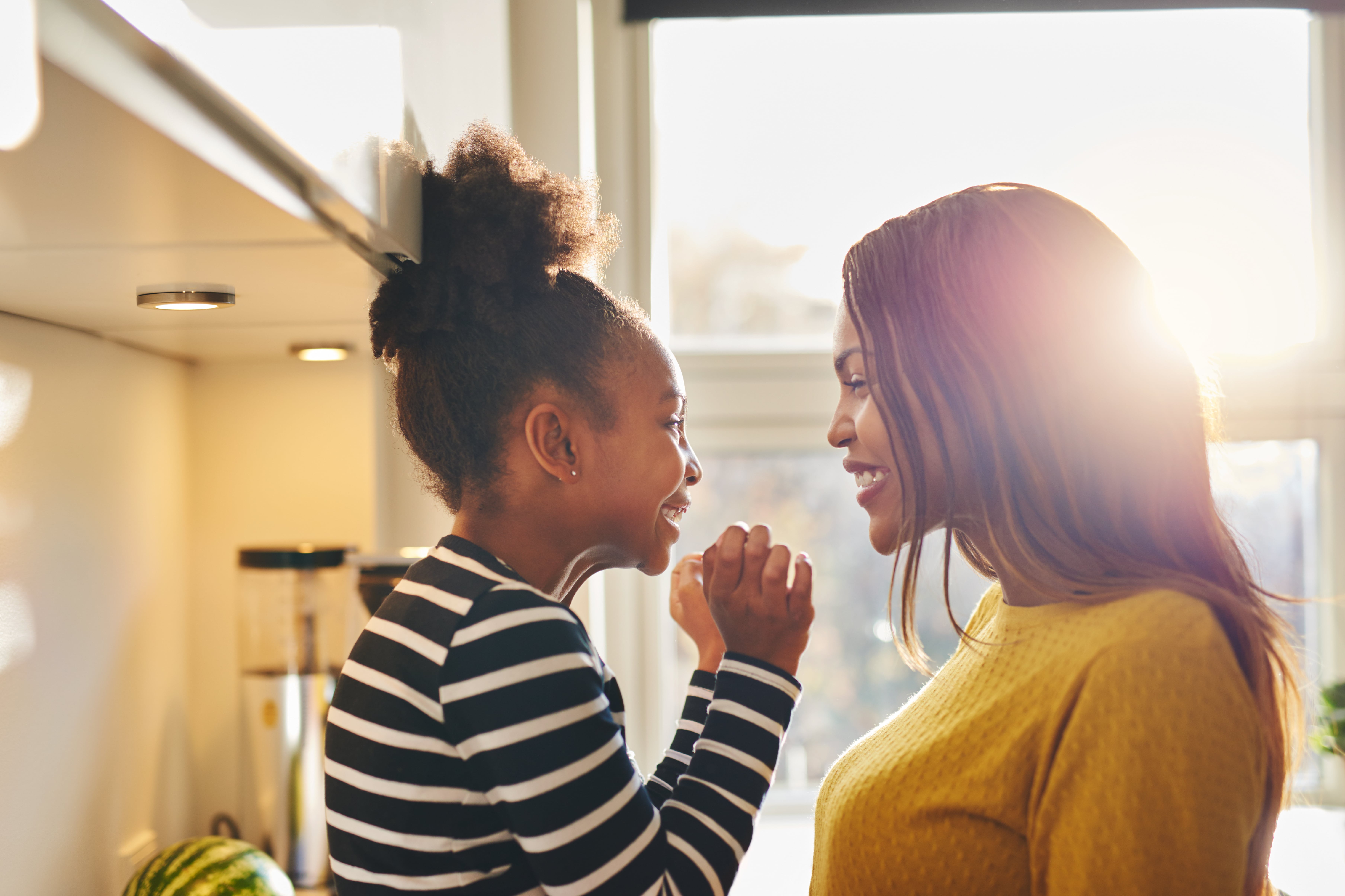 mother and daughter smiling 